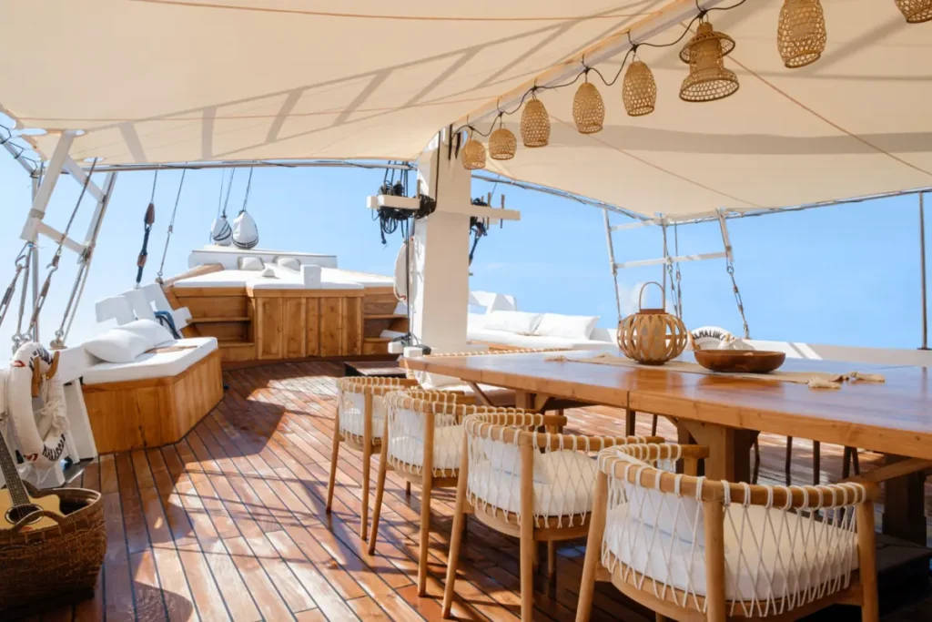 Komodo Luxury liveaboard sundeck dining setup overlooking the sea