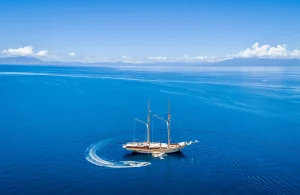 Aerial view of luxury phinisi yacht in Komodo National Park