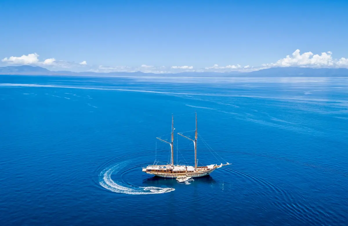 Aerial view of luxury phinisi yacht in Komodo National Park
