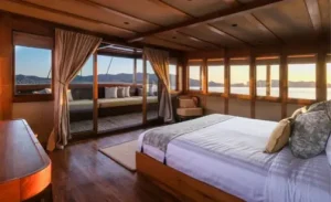 Master suite on a luxury phinisi yacht with beautiful ocean views