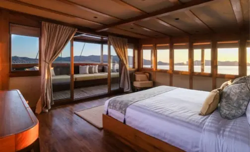 Master suite on a luxury phinisi yacht with beautiful ocean views