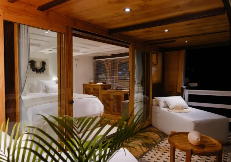 A night view of a Private suite and outdoor lounge on a phinisi yacht