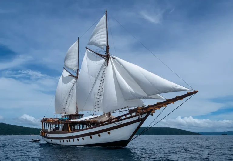 Majik luxury liveaboard yacht cruising through the waters of Komodo National Park.
