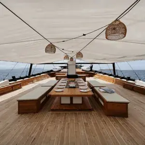 Phinisi yacht open dining deck with with the view of the ocean
